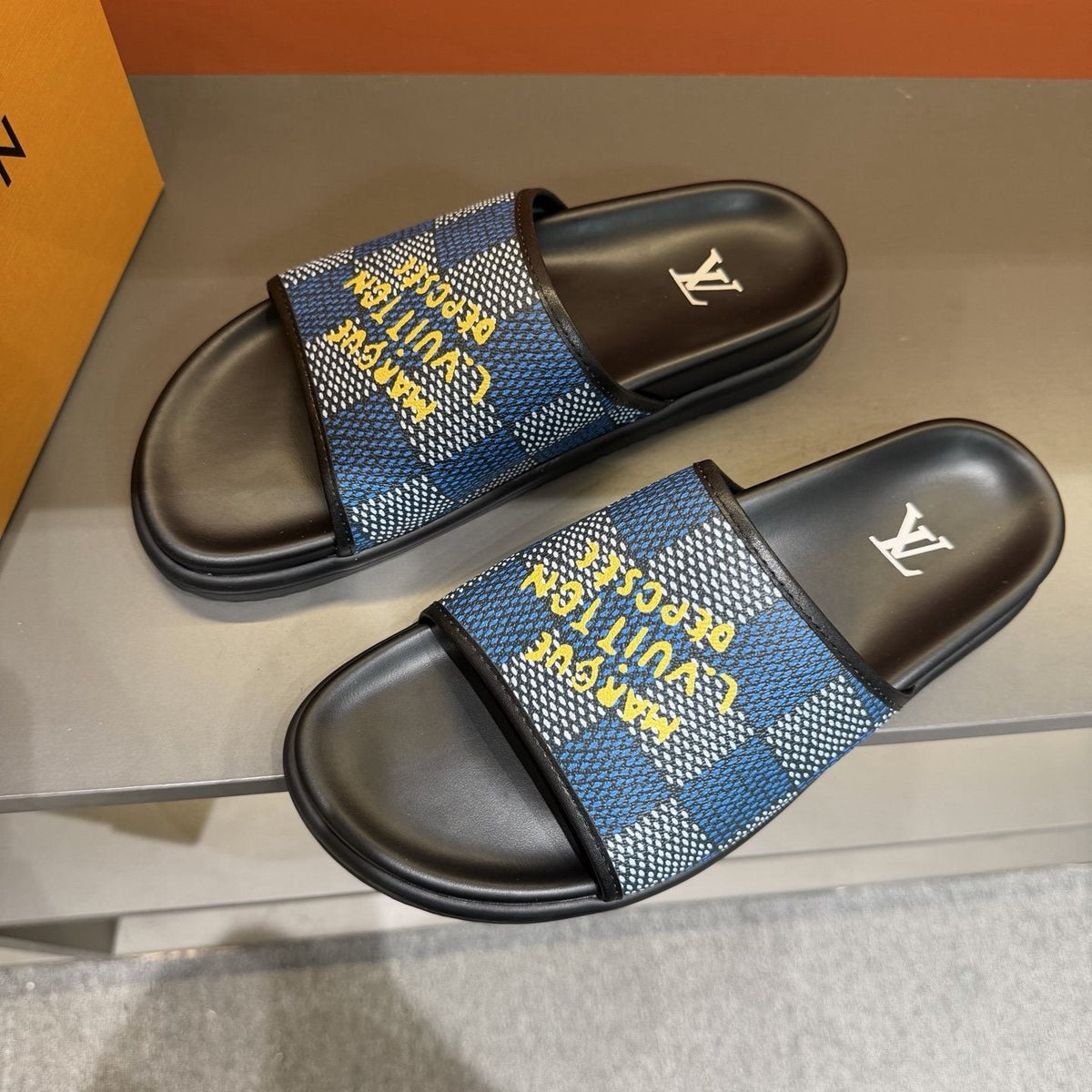 Louis Vuitton Patterned Strap Slides — front